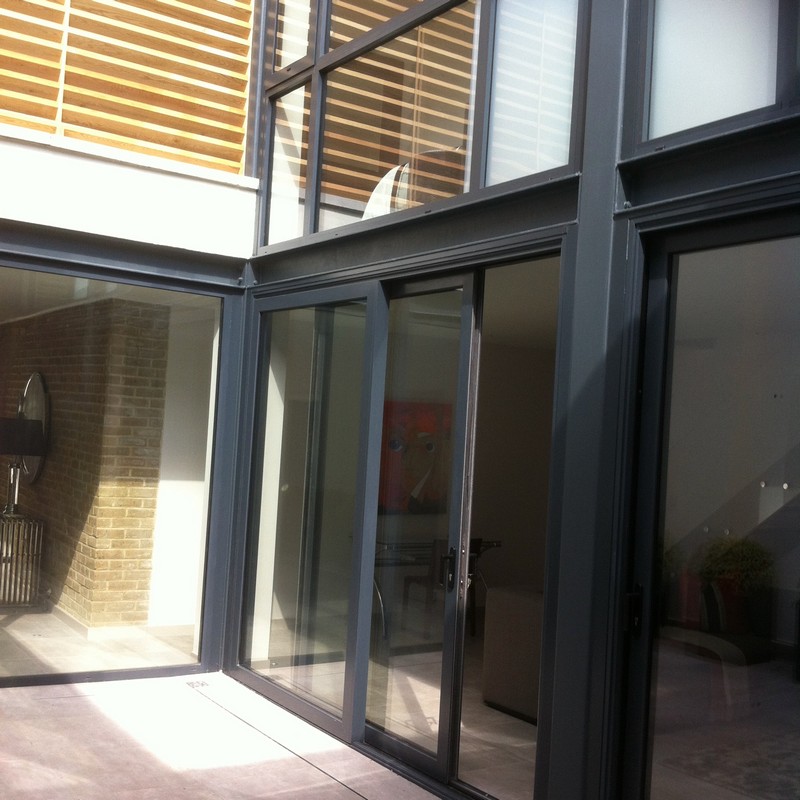 Anthracite aluminium sliding patio doors fitted in Holland Park